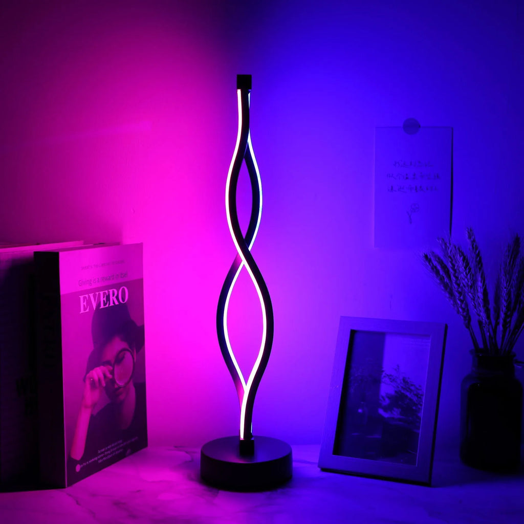 Black aluminium desk lamp with touch dimming and a three-colour button on a desktop