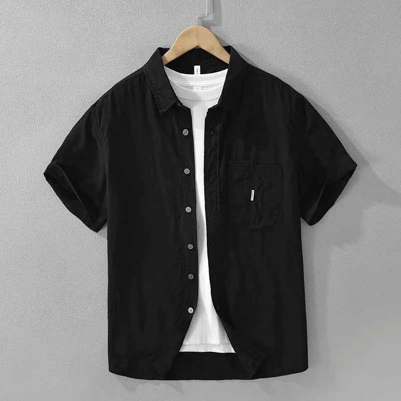 Loose-fit short-sleeve cardigan top in lyocell fabric, shown in black colour.