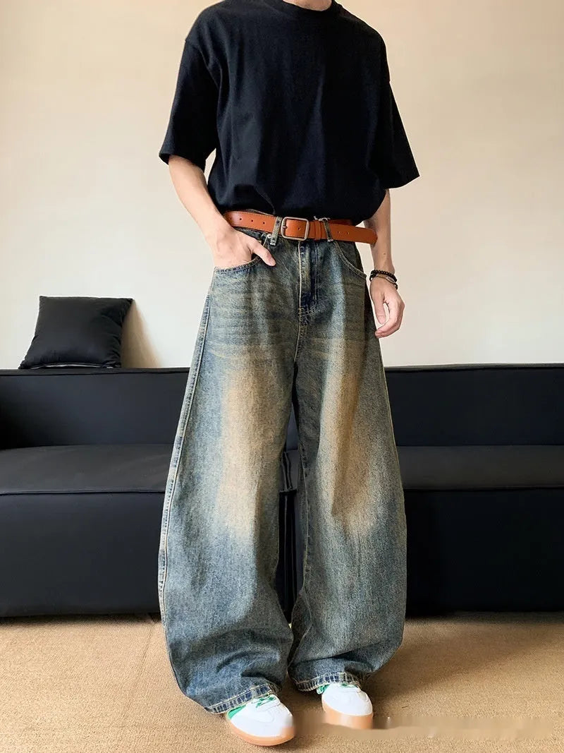 Men's retro blue distressed denim jeans with slim wide-leg cut and micro stretch fabric