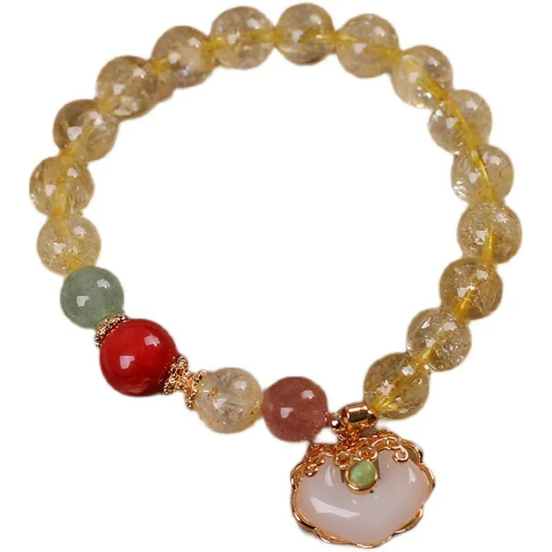 Women's alloy bracelet with a yellow hair crystal jade ruyi pendant charm.