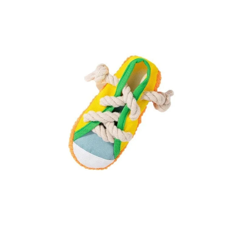 Plastic slipper-shaped dog chew toy with squeaker in yellow, black, or blue.