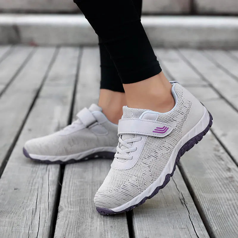Women's grey purple wedge heel shoes with a mesh upper and velcro strap fastening.