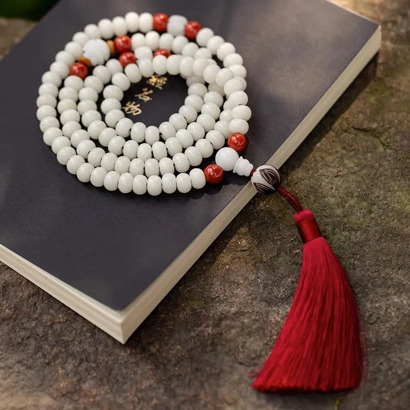 White jade Bodhi bead bracelet with 6x8mm beads in various decorative styles