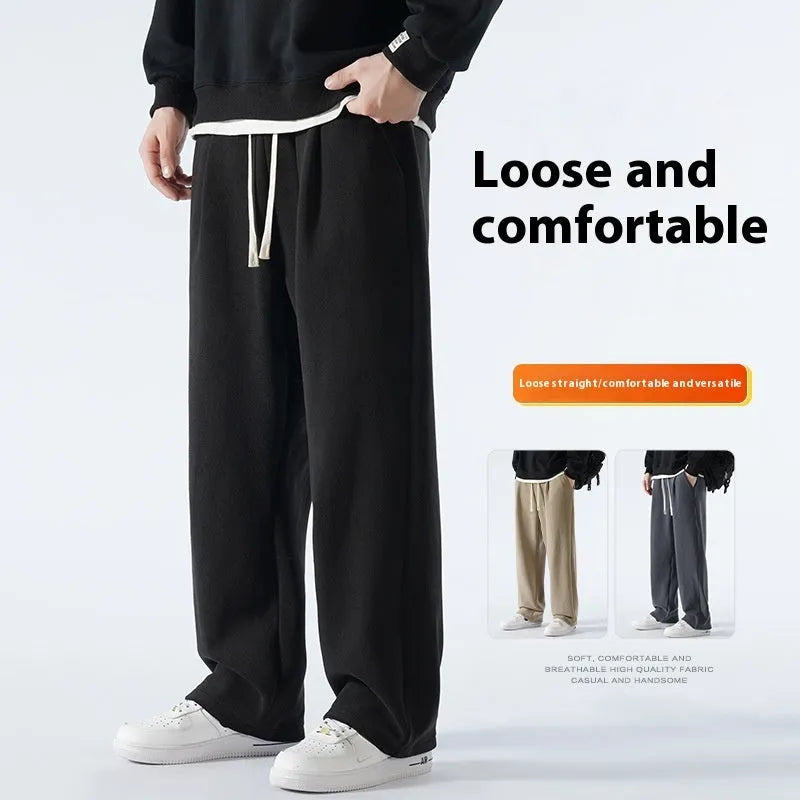 Men's apricot coloured loose-fit polar fleece winter trousers with a drawstring waist, shown flat.