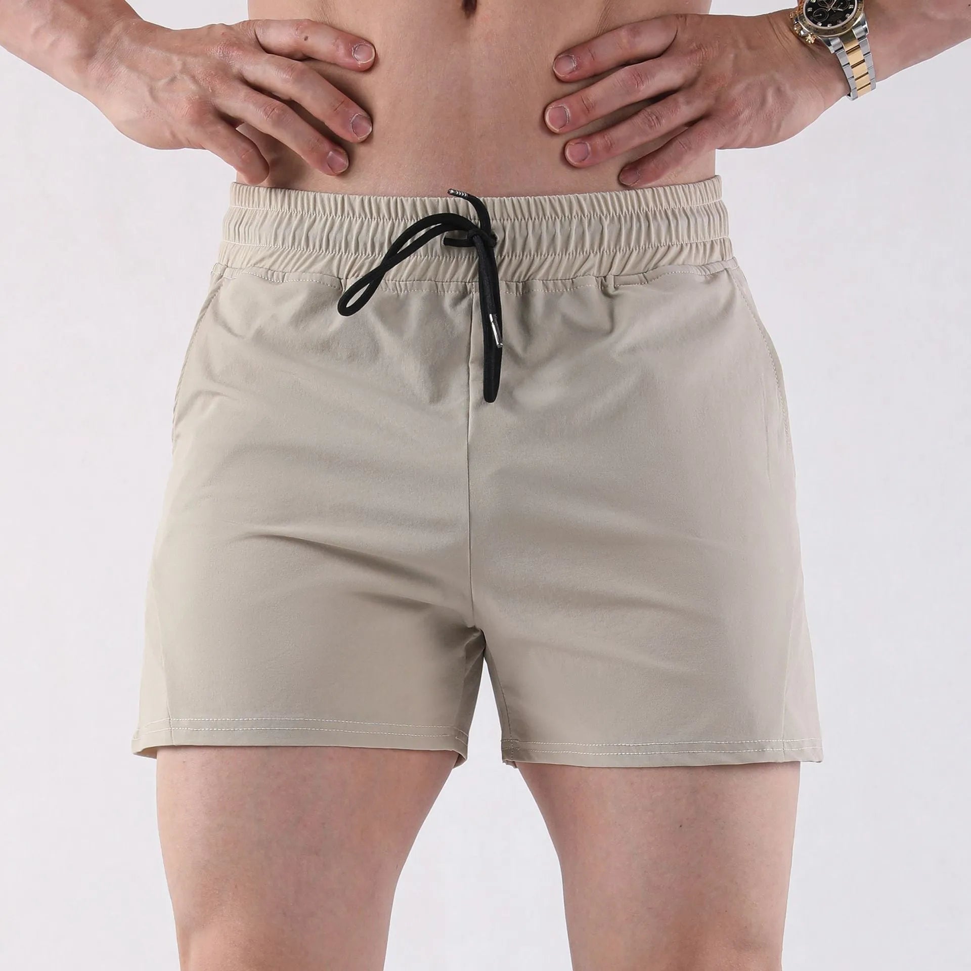 Men's thin basketball shorts in grey, black, apricot, or green with an elasticated waistband.