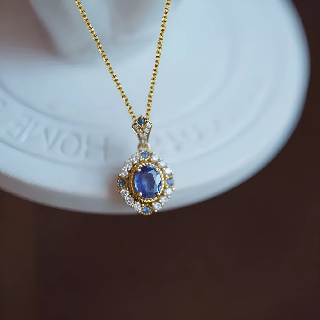 Women's royal necklace with mixed gem pendant on box chain in yellow gold colour