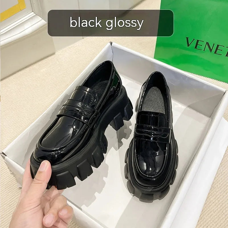 British style wide fit patent leather loafers with a rubber sole and muffin heel, shown in a choice of finishes.