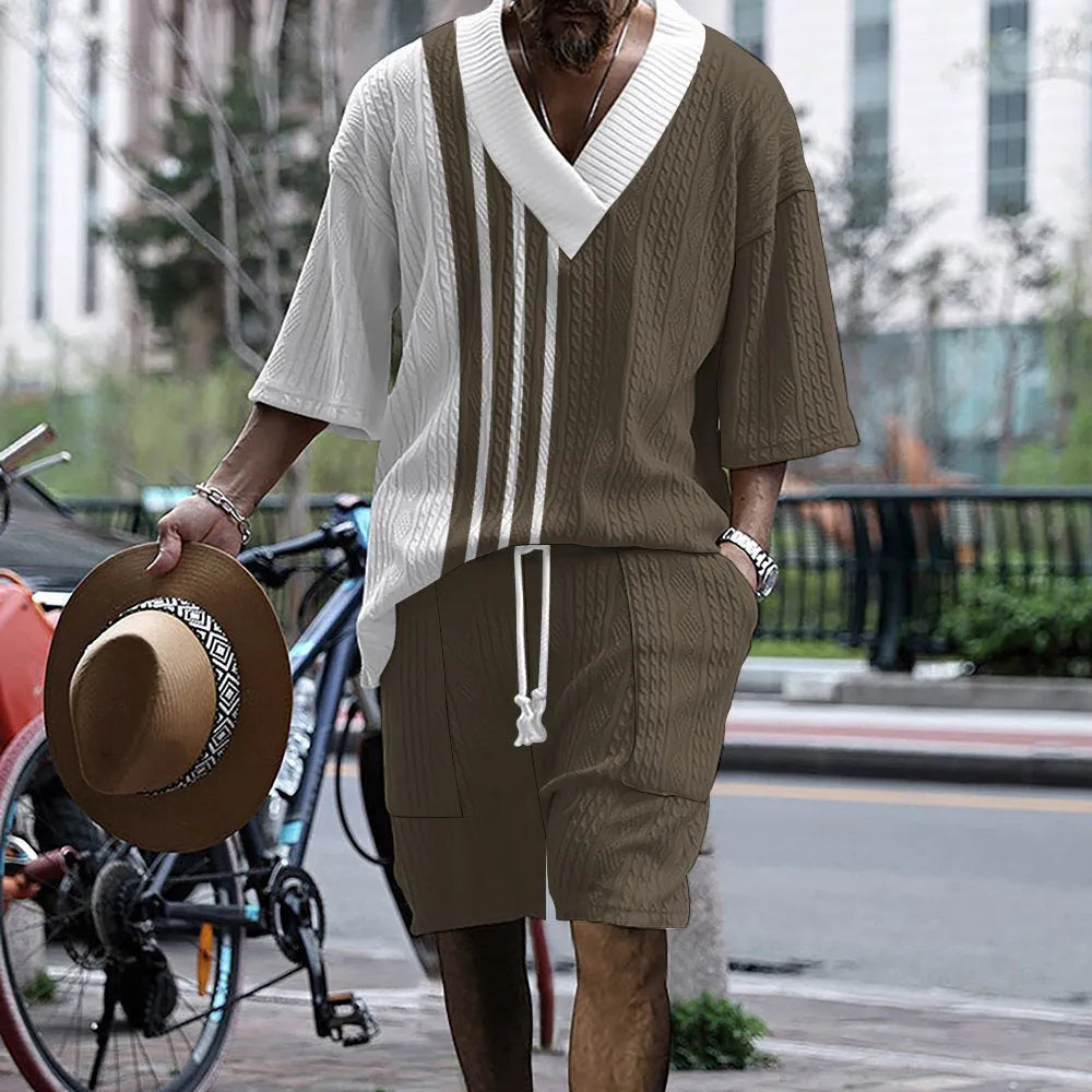 Man wearing a printed drop-shoulder knitted short-sleeve top with matching shorts, a casual summer suit set.