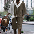 Man wearing a printed drop-shoulder knitted short-sleeve top with matching shorts, a casual summer suit set.