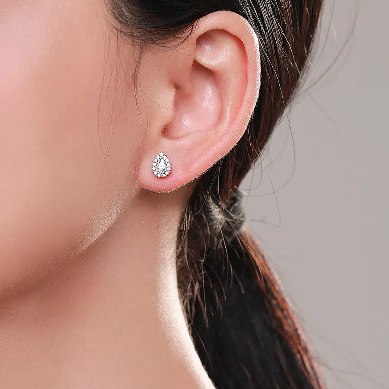 Women's silver water drop ear studs with 925 sterling silver construction and diamond treatment