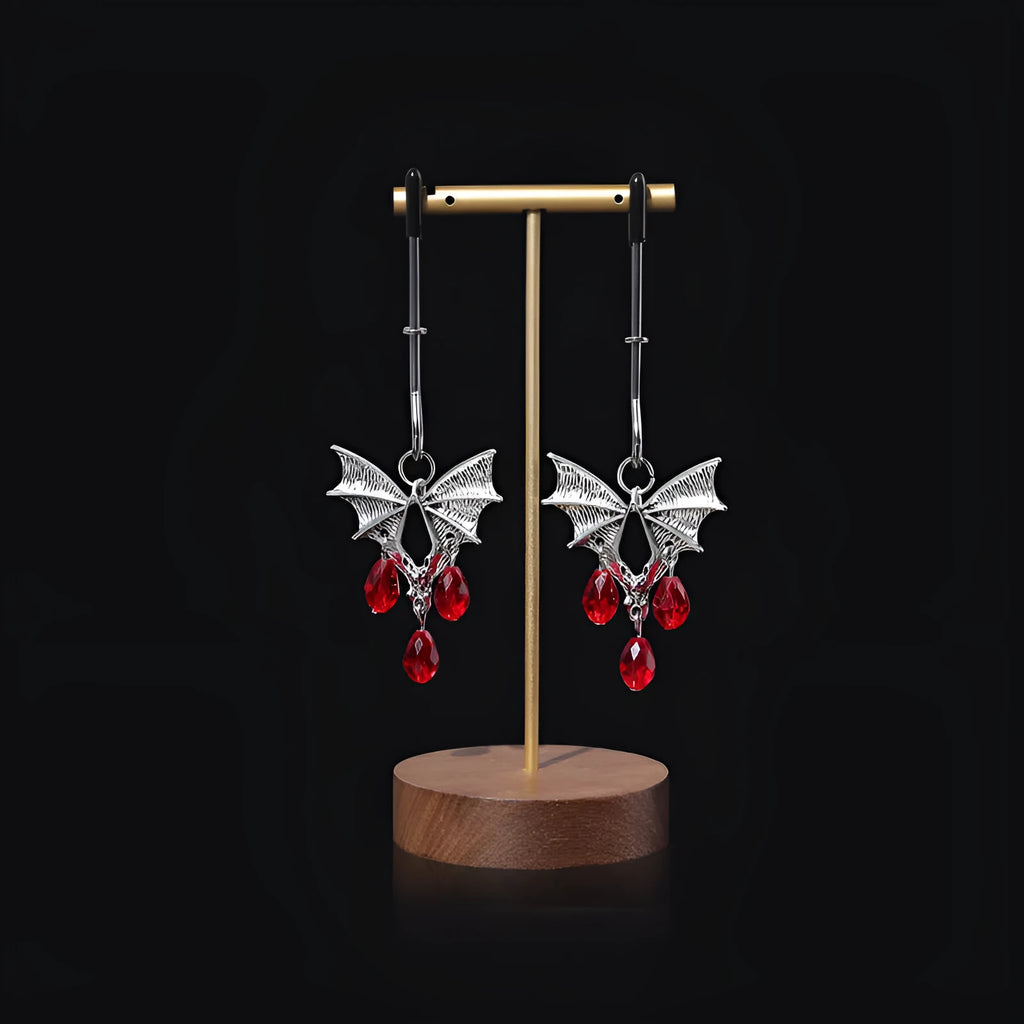 Silver bat nipple clamp with adjustable ruby clip for clitoral stimulation