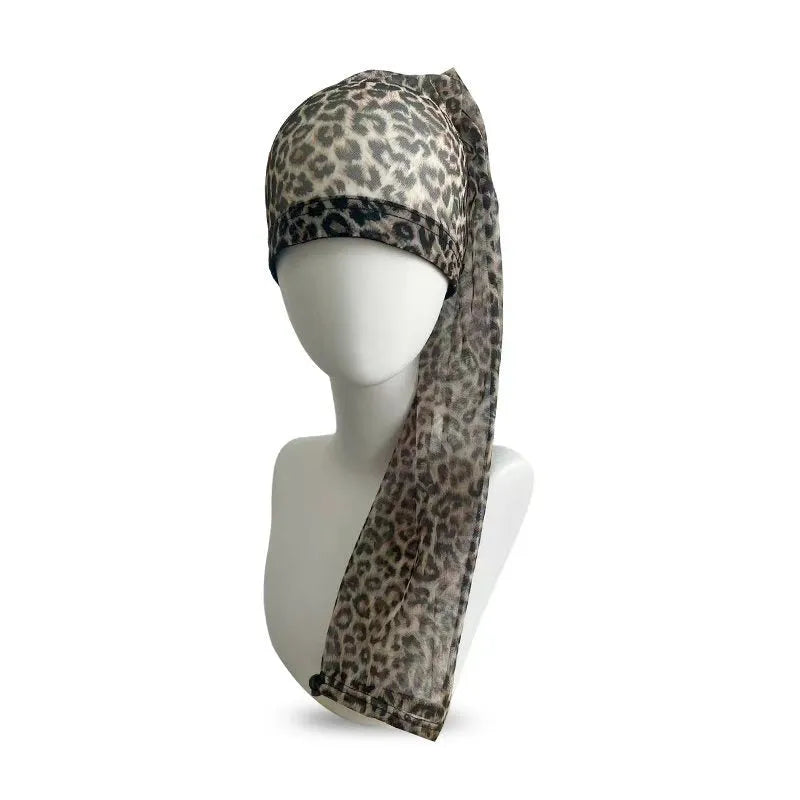 Mesh wig cap with elastic oversleeve design shown in various colour options including leopard print