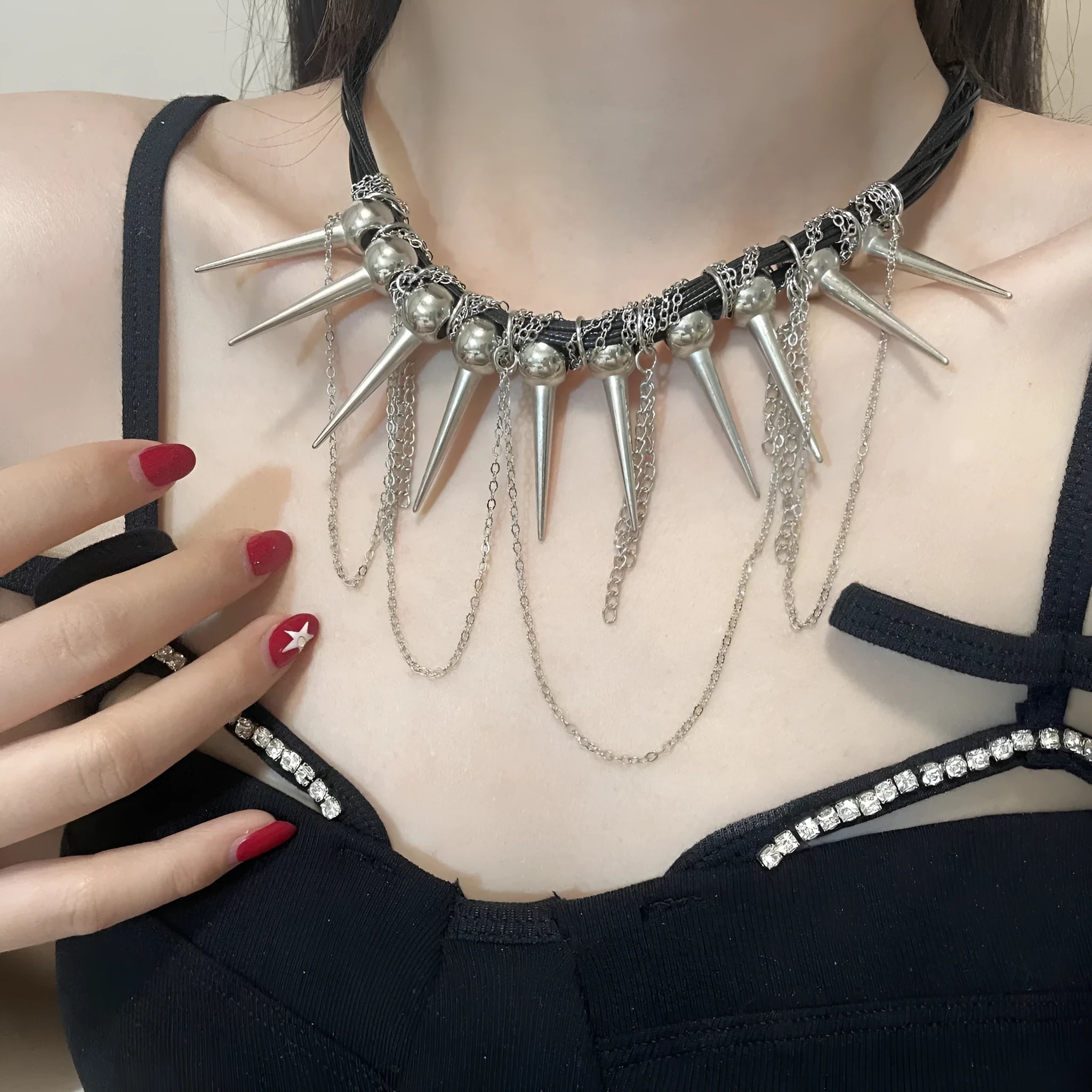 Leather necklace with round beads and winding tassel design featuring point rivet details