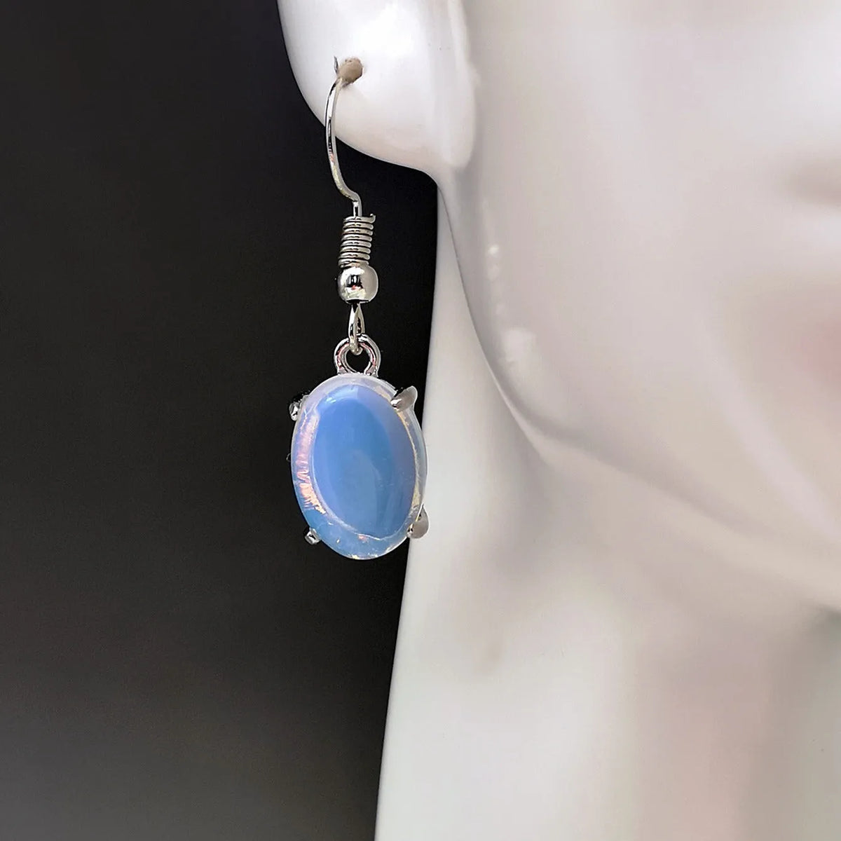 Moonlight white opal drop earrings with retro moonstone design and cross motif on alloy