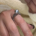 Adjustable open ring with geometric black pearl design on index finger