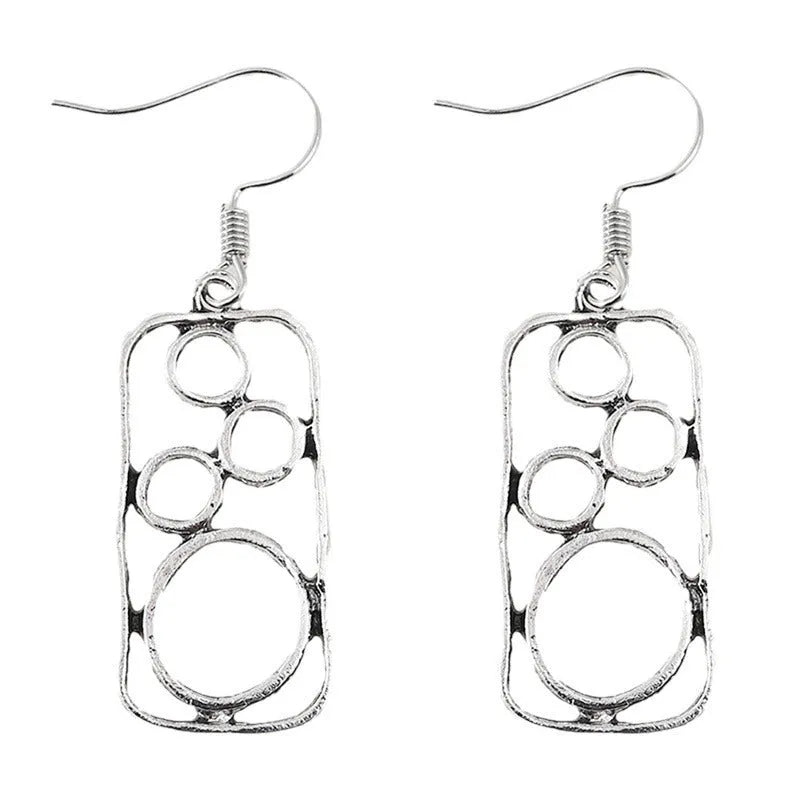 A pair of geometric round earrings with an irregular square shape in antique silver finish.