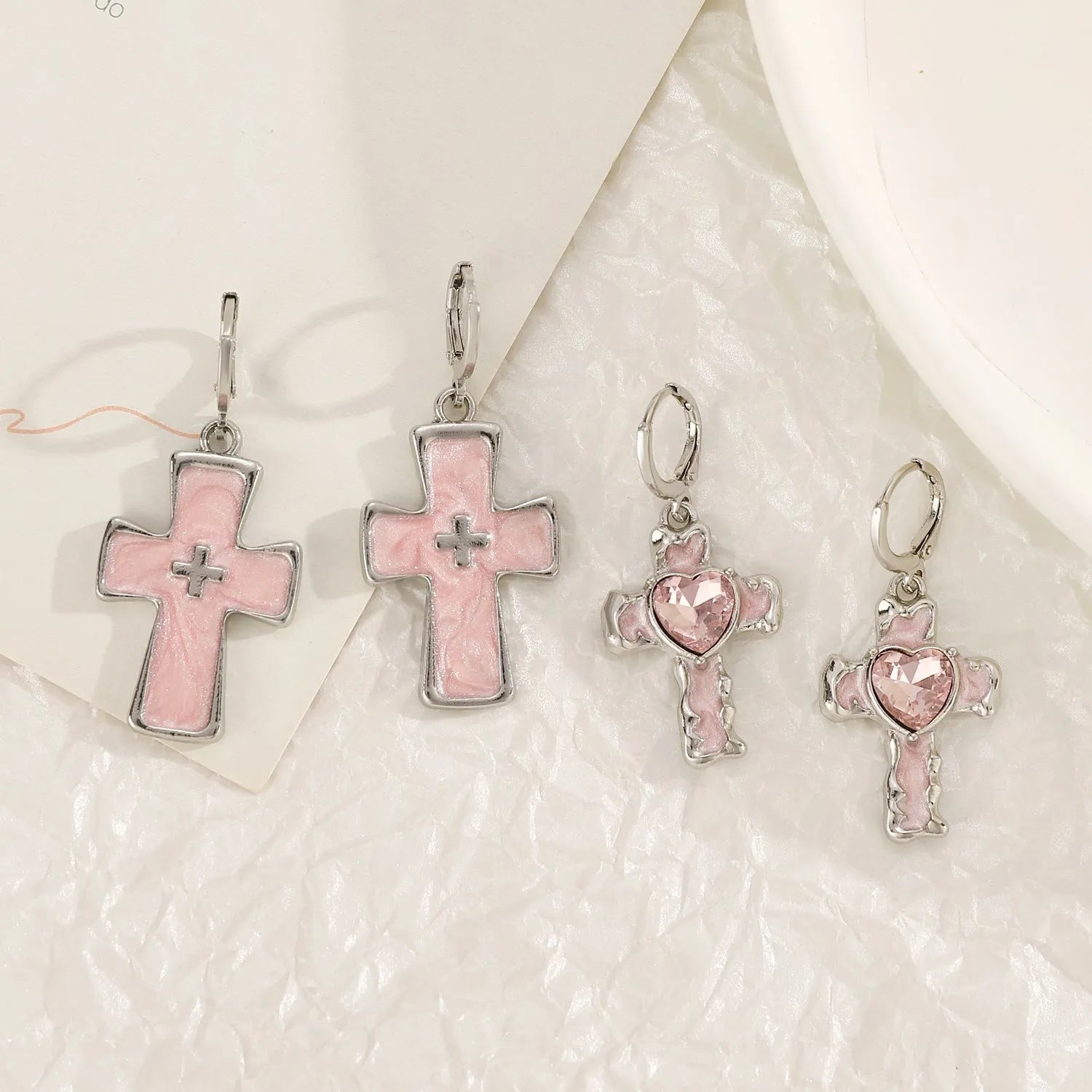 Women's alloy earrings with cross, heart, animal, and zodiac designs in white, black cat, and antique silver finishes