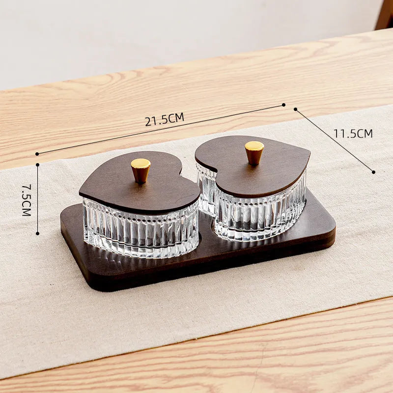 Glass retro-style serving platter with heart-shaped transparent lid and multiple food compartments.