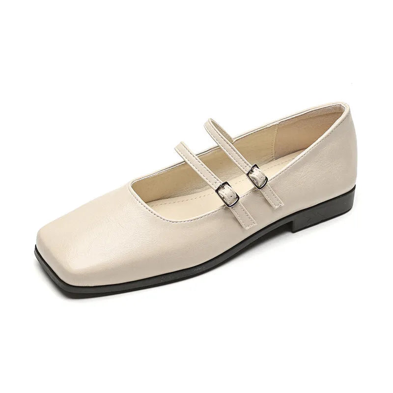 Women's silver leather ballet pumps with a cross buckle strap and flat heel