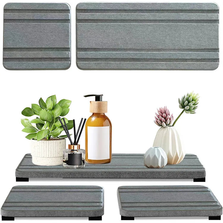 Set of three square bathroom countertop water draining pads in diatom oil material