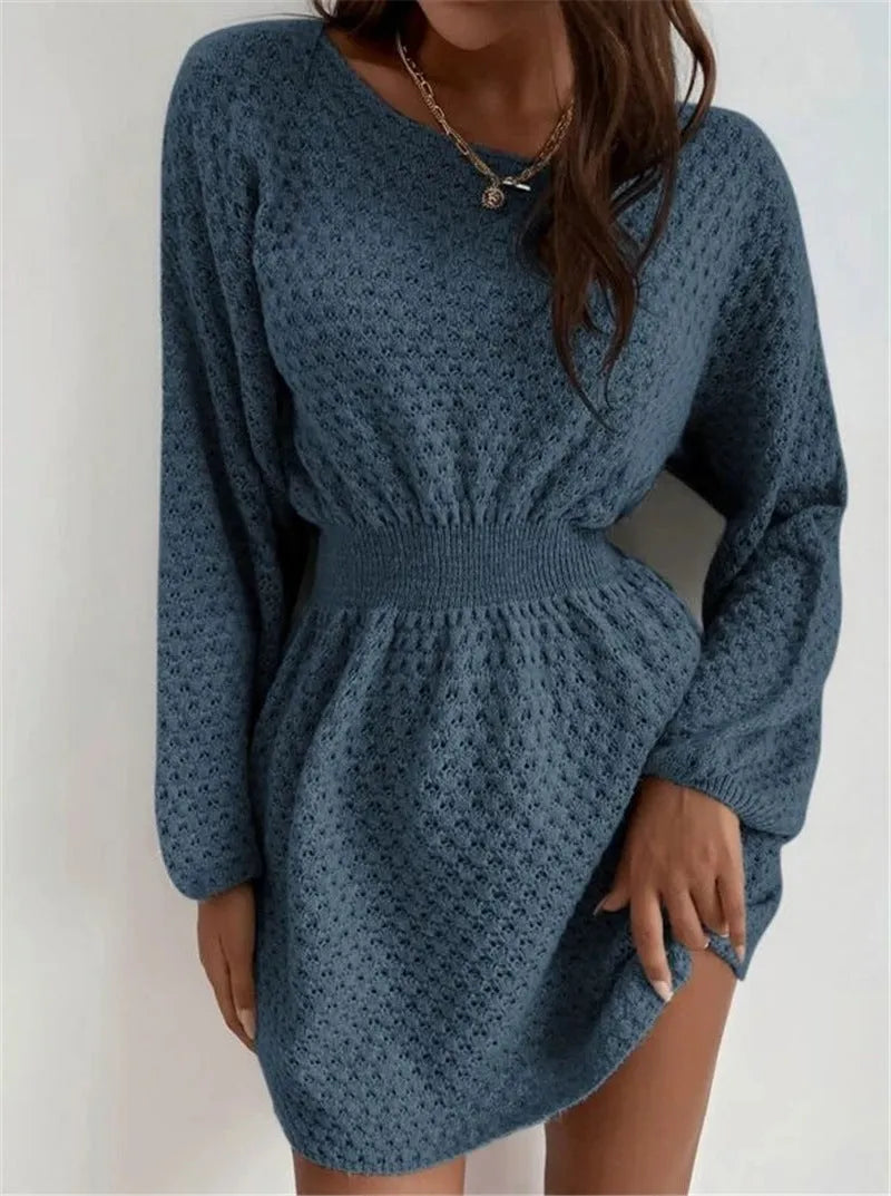 Blue women's knitted dress with crocheted flowers, a round neck, and a fitted waist.