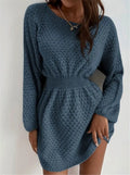 Blue women's knitted dress with crocheted flowers, a round neck, and a fitted waist.