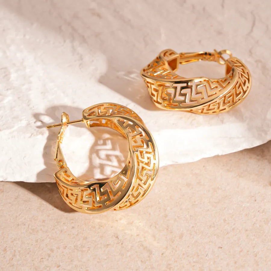 Geometric hollow stud earrings with twisted round design in gold electroplated finish
