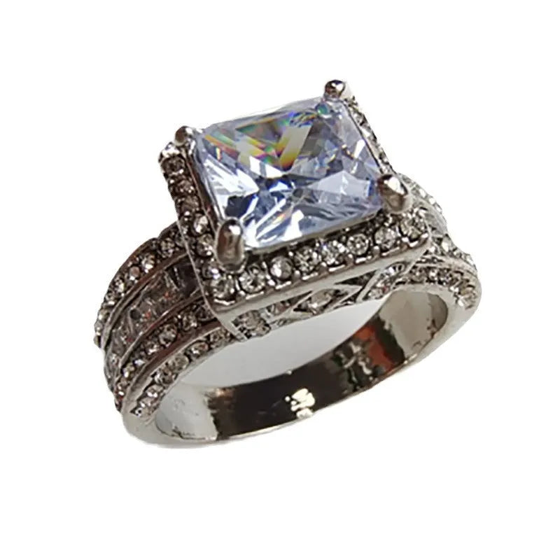 Geometric women's fashion ring with electroplated metallic finish in gold or white colour options