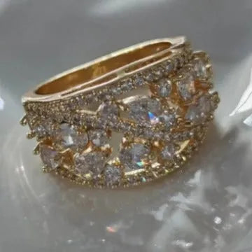 Women's hollow fashion ring in copper with stone accents, shown in gold and platinum colour options.