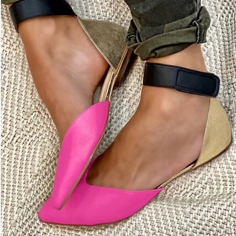 Women's flat-heel sandals with velcro straps and a hollowed upper design, shown in a beige colour.