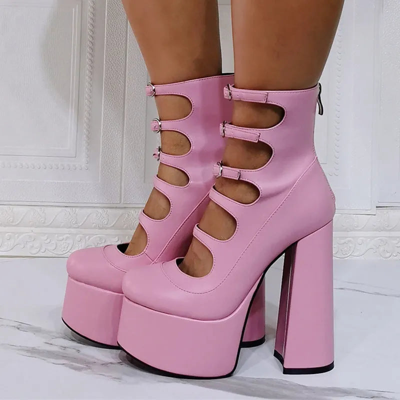 Women's black patent leather platform high heels with a thick serpentine ankle strap and buckle fastening.