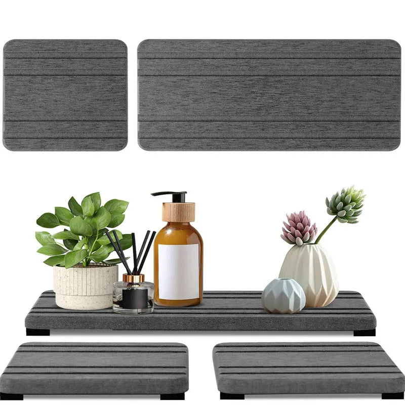 Set of three square bathroom countertop water draining pads in diatom oil material