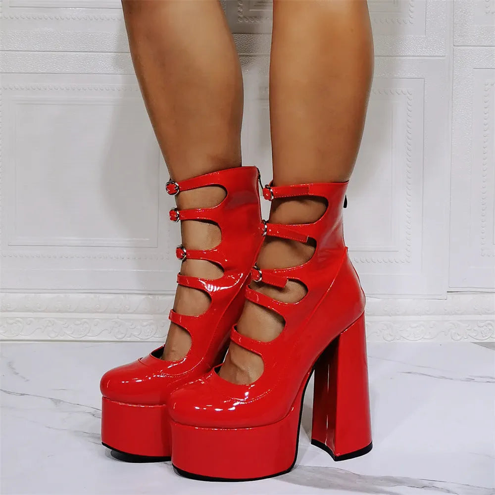 Women's black patent leather platform high heels with a thick serpentine ankle strap and buckle fastening.