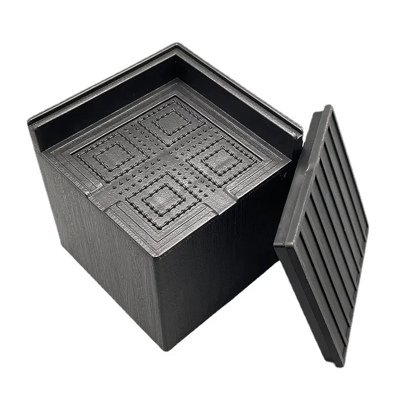 Four black plastic furniture riser mats for increasing bed and sofa height