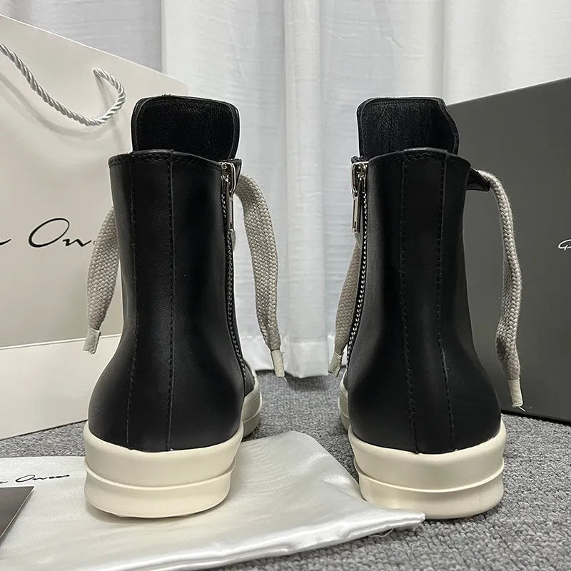 Black genuine leather high-top sneakers with a side zipper and round toe on a rubber platform sole.