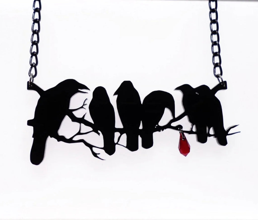 Black electroplated alloy crow necklace with cross chain design and zodiac elements