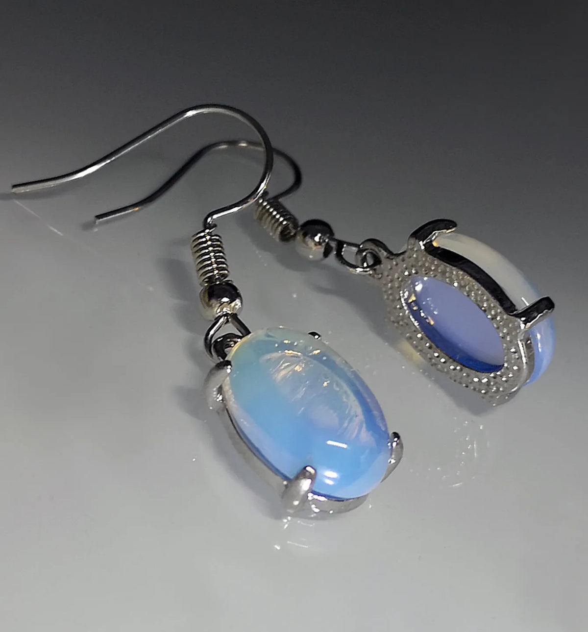 Moonlight white opal drop earrings with retro moonstone design and cross motif on alloy