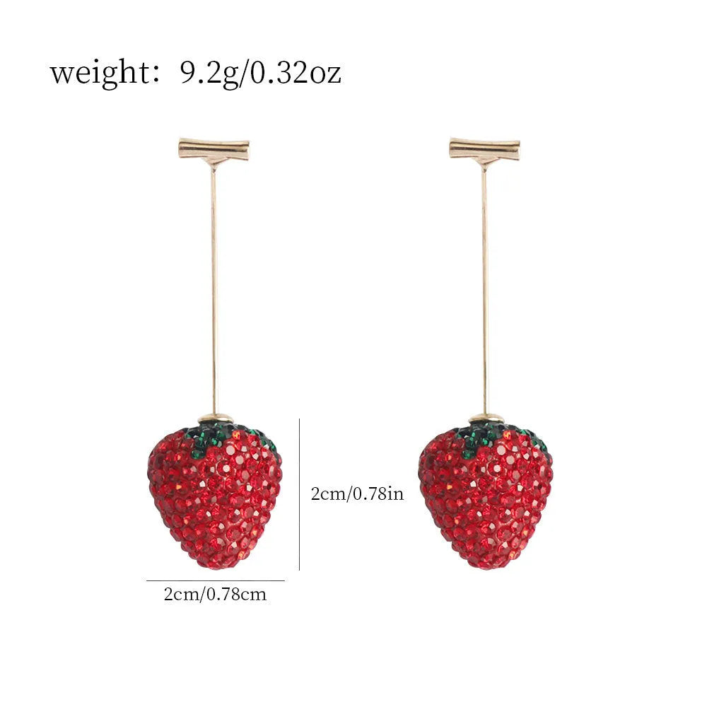 Close-up of geometric spot-drill strawberry stud earrings in red zinc alloy, shown on a plain background.