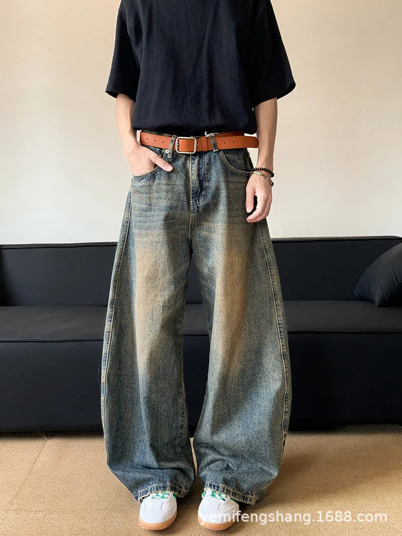 Men's retro blue distressed denim jeans with slim wide-leg cut and micro stretch fabric