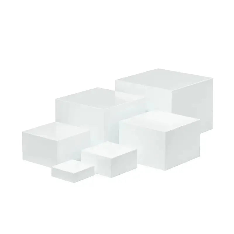 White plastic Suit Cube dessert display stand with six modular pieces arranged in multi-level configuration