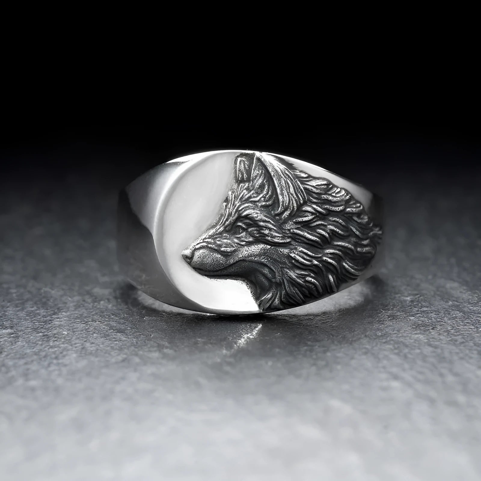 Men's silver alloy ring with geometric wolf design showing side profile