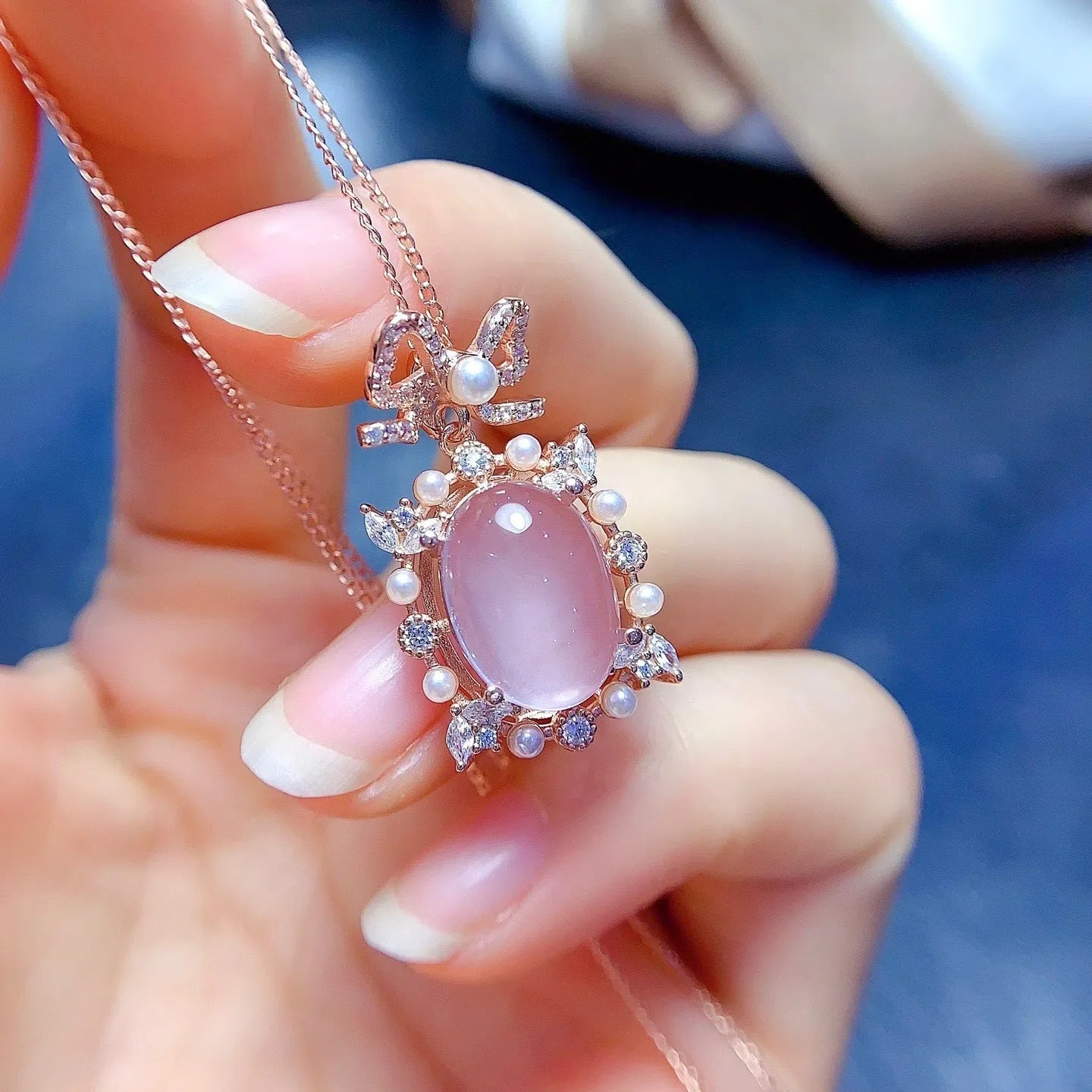 Geometric rose quartz pendant necklace with rose gold plated silver mounting on alloy chain
