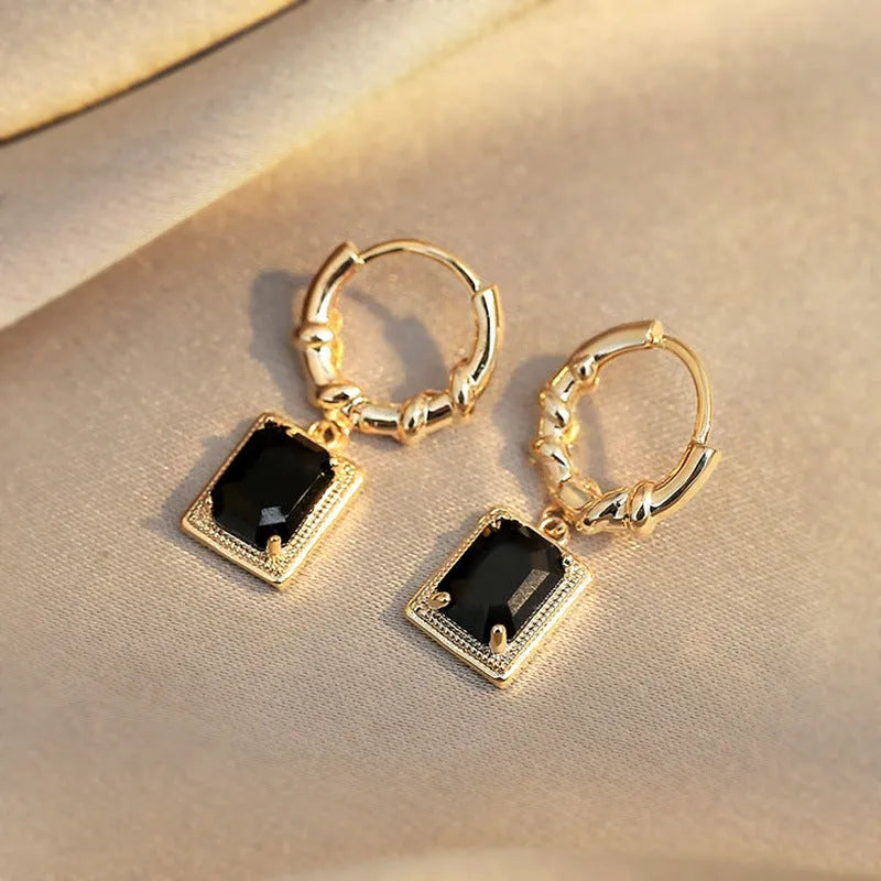 A pair of black zircon geometric copper French court earrings with a quadrilateral shape.