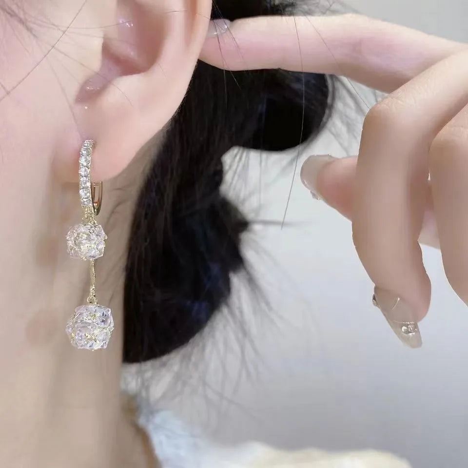 Silver women's earrings with balloon and rhinestone pendants in drop shape design.