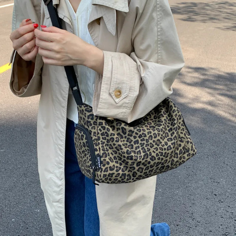 Leopard print sports style shoulder messenger bag with cross-body strap and large capacity design