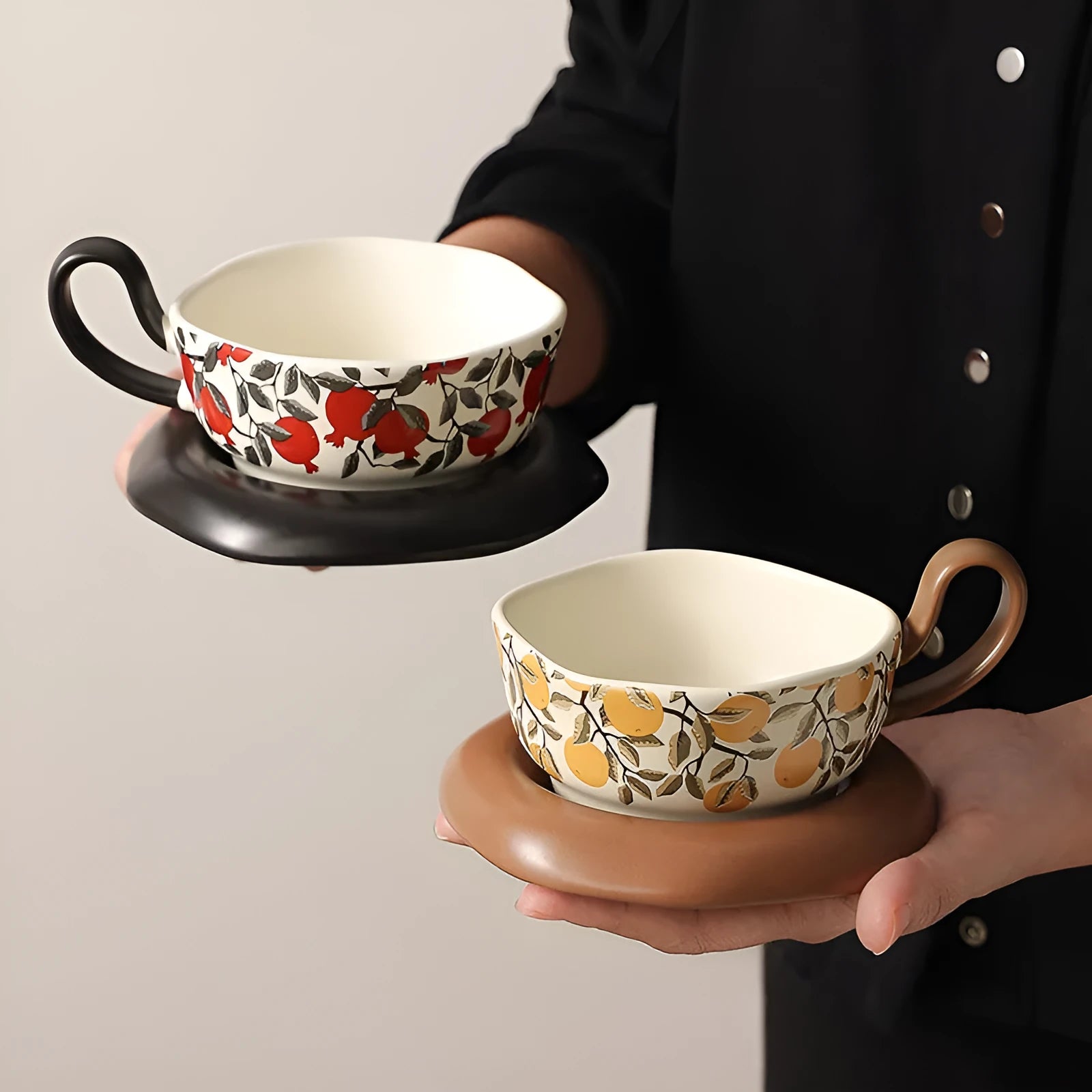 Antique style ceramic coffee cup and saucer set with 210ml capacity in black or orange retro design.