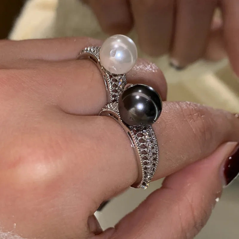 Adjustable open ring with geometric black pearl design on index finger