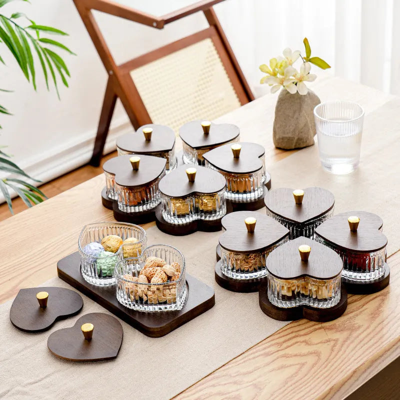 Glass retro-style serving platter with heart-shaped transparent lid and multiple food compartments.
