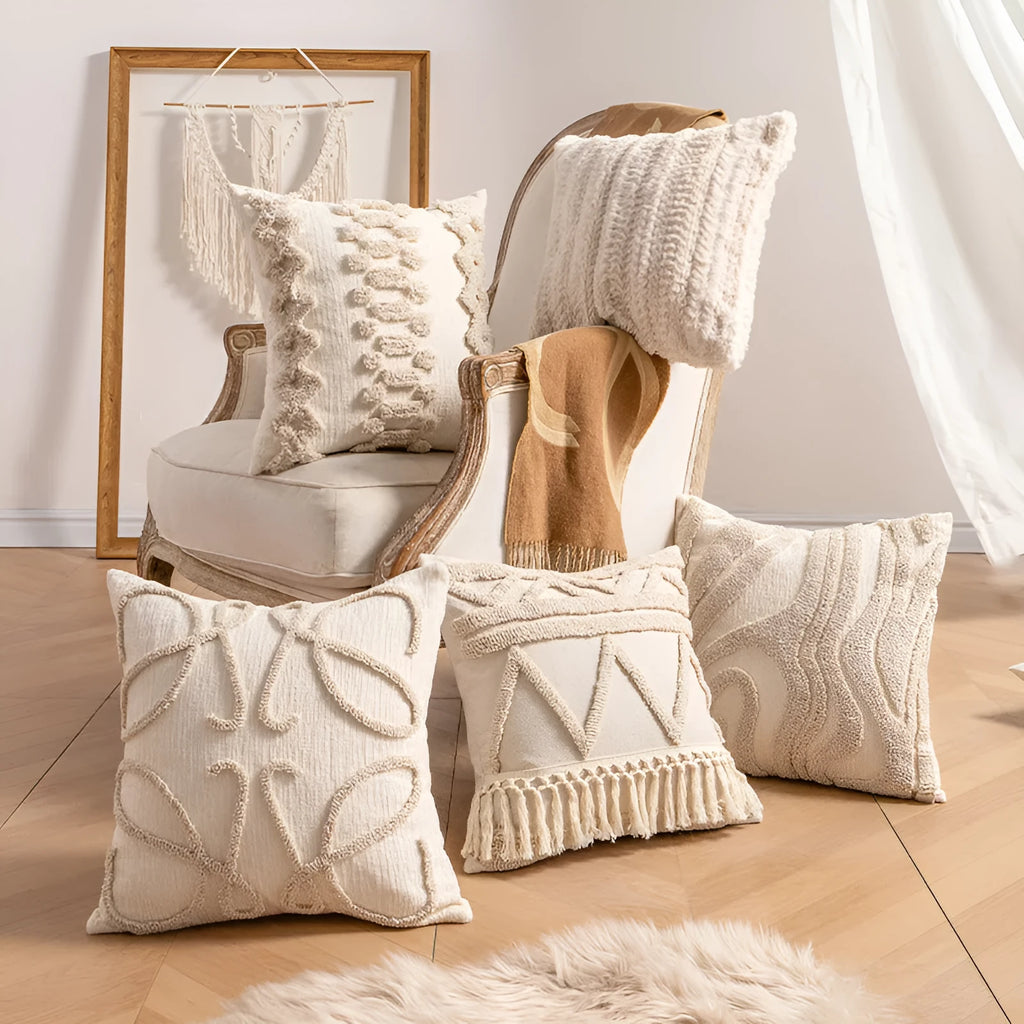 Knitted cushion cover with tassel fringe in a striped pattern, shown in spiral dots design.
