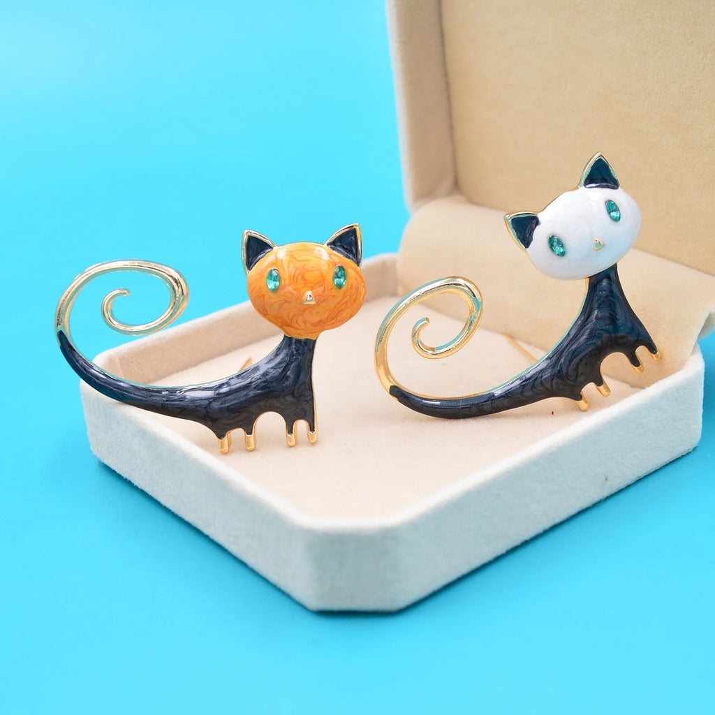 Alloy cat brooch with painted tail detail in white or orange colour for women's decorative fashion accessory